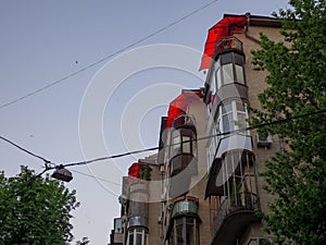 Brick facade of a soviet building with fancy balconies shelters