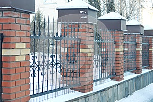 brick fence with bars