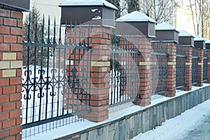 brick fence with bars