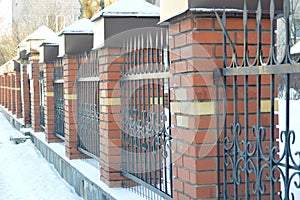 brick fence with bars