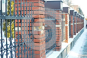 brick fence with bars