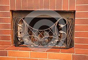 Brick fireplace with metal fire grate