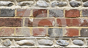 Brick and flintstone wall photo
