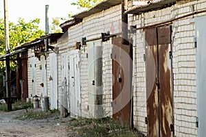 Brick garages with metal gates of a garage cooperative