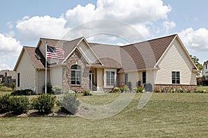 Brick home with American flag