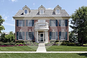 Brick home with blue shutters