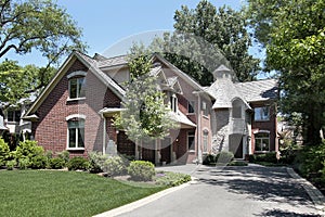 Brick home with circular stone entryway