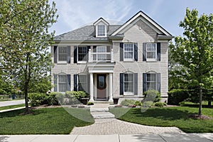 Brick home with front balcony