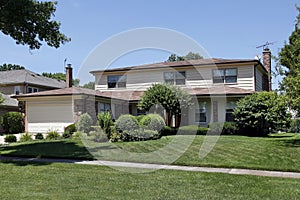 Brick home with shingled roof