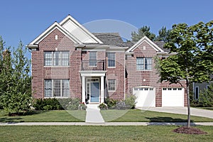 Brick home with white columns