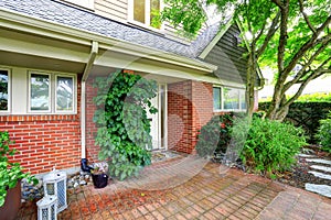 Brick house exterior with tile floor front yard