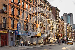 Brick house with Fire ladder in streets in Down Manhattan, Chinatown.