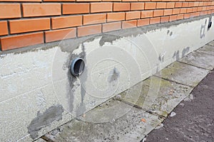 Brick house foundation wall insulation with styrofoam sheets for Energy Saving Home.