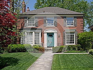 Brick house and front lawn