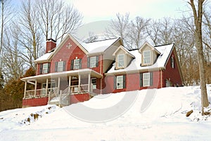 Brick House on a Snowy Hillside