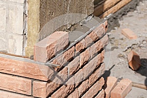 Brick laying on top of a mineral insulation