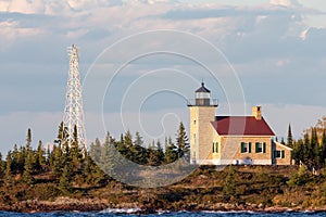 Brick Lighthouse with Red Roof in Warm Light