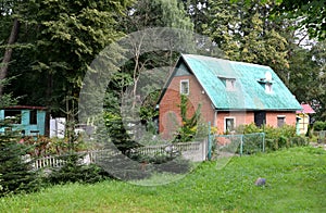 Brick lodge on the seasonal dacha about the wood