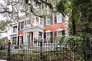 Brick Mansion Behind Wrought Iron