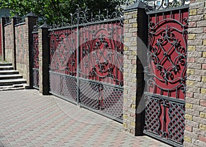 Brick and Metal Fence with Door and Gate.