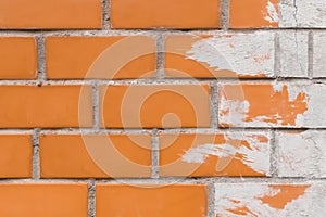 Brick old urban wall in orange light brown white paint abstract brush design pattern street texture background