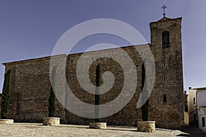 Brick outer wall of Church of San Juan Bautista in the village of Alarcon, Cuenca, Spain photo