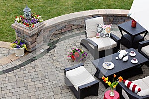 Brick paved patio with patio furniture
