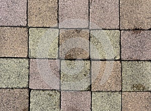 Brick pavement tile, top view. Urban texture as background. Stone pavement texture. Granite cobblestoned pavement