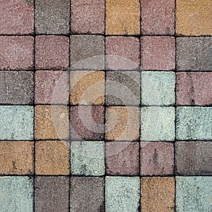 Brick pavement tile, top view. Urban texture as background. Stone pavement texture. Granite cobblestoned pavement background