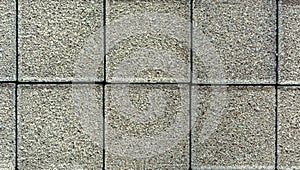 Brick pavement tile, top view. Urban texture as background. Stone pavement texture. Granite cobblestoned pavement background.