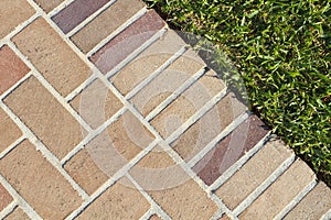 Brick Pavers Walkway And Lush Green Grass