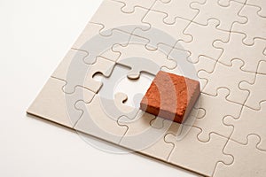 A brick in a puzzle instead of a missing piece.