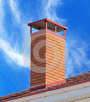 brick smokestack on background sky