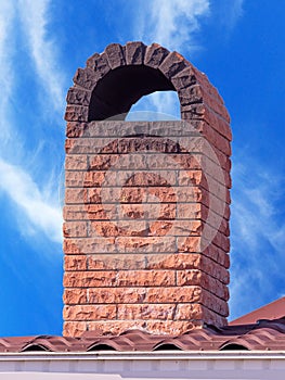 brick smokestack on background sky