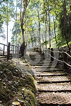 Brick staircase with the fence to the top of the hill