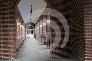 Brick and stone hallway with arched doorways