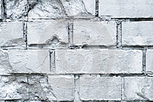 Brick stone wall painted in silver, graffiti background