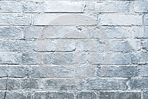 Brick stone wall painted in silver, graffiti background