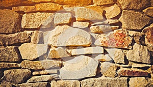 Brick stone wall stack of medieval natural stone texture background or rock strata boundary the rock seamless abstract and