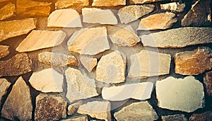 Brick stone wall stack of medieval natural stone texture background or rock strata boundary the rock seamless abstract and