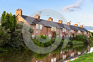 Brick terraced houses along a canal