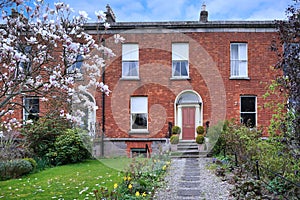 Brick townhouse with spring flowers