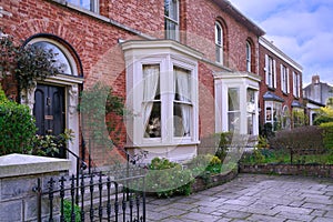 brick townhouses with bay windows