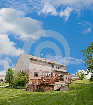 Brick and Vinyl House Back Yard