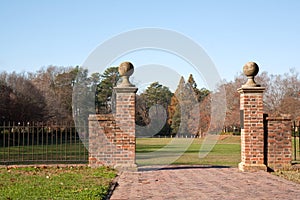 Brick walkway to a garden in autumn