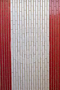 Wall of Brick Painted in Red and White Bands photo