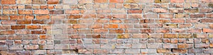 Brick wall as a rough textured and patterned abstract background