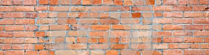 Brick wall as a rough textured and patterned abstract background