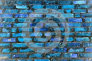 Brick wall background with colored bricks