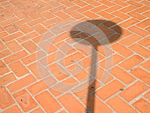 Brick wall background textured with shadow of traffic sign